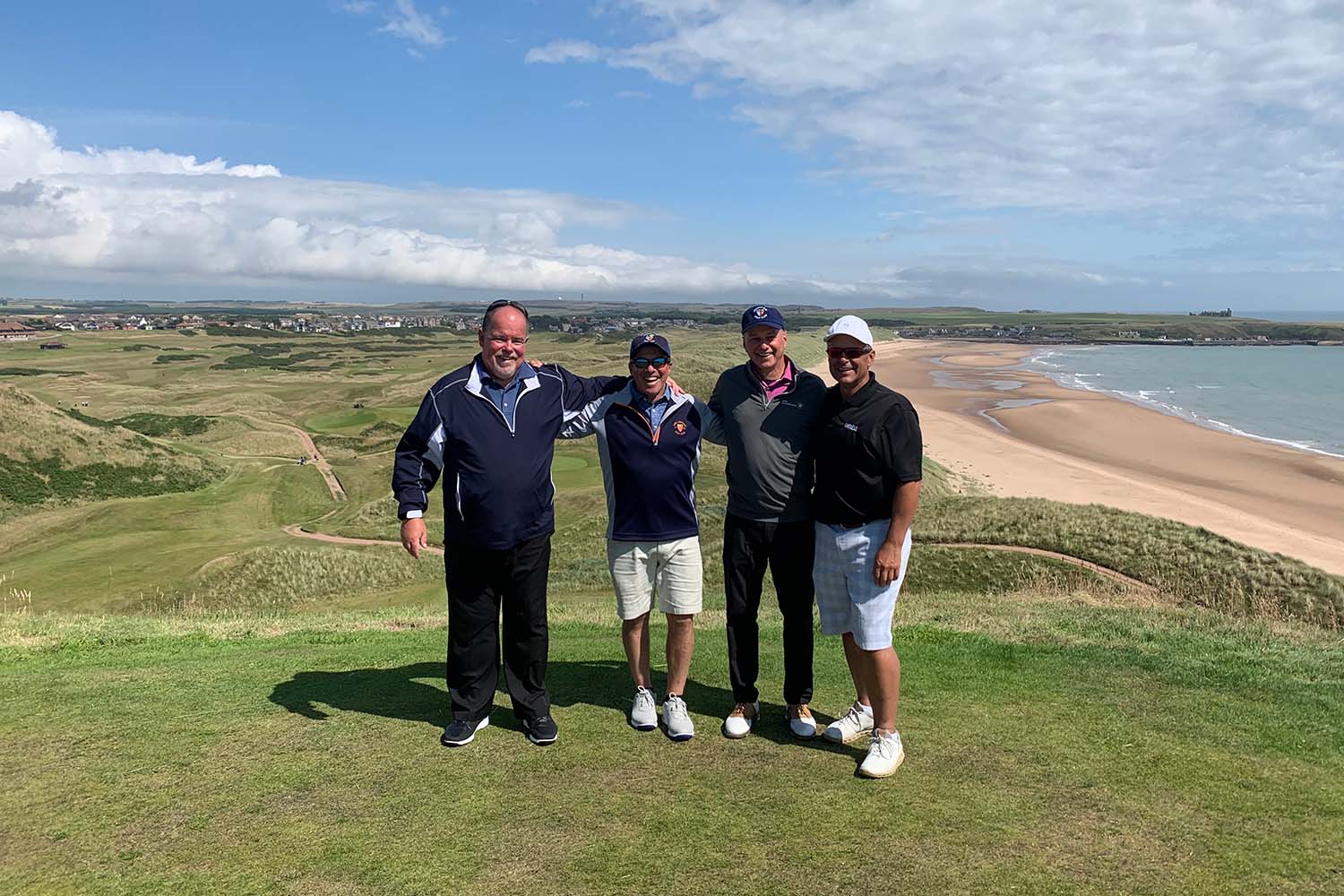 where-to-play-golf-in-scotland Golfers in Scotland at Cruden Bay
