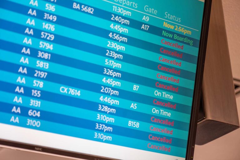 Airport board with canceled flights for a golf trip