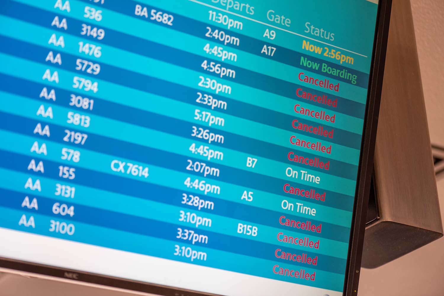 golf-trip-problems Airport board with canceled flights for a golf trip