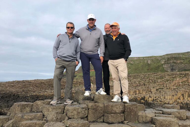 Golfers visiting the Giant's Causeway in Northern Ireland