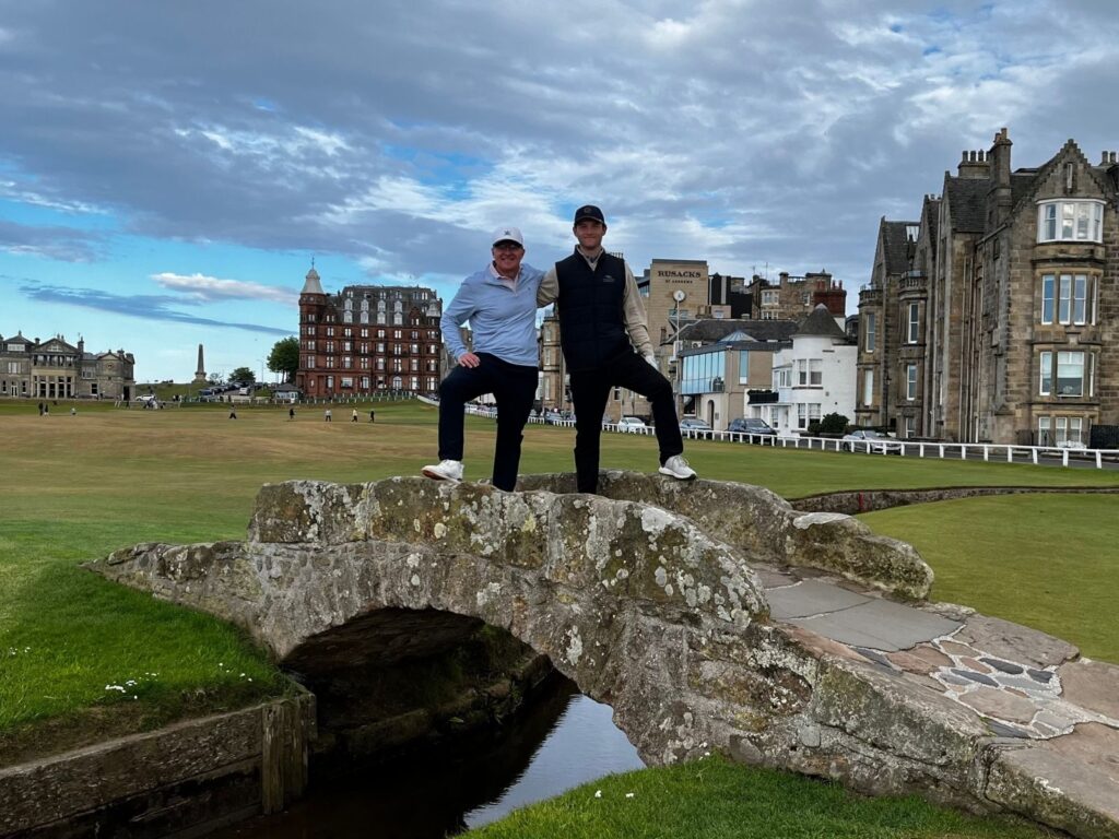 Kent and Kyle Muckel from Colorado Golf Club cross the most famous little bridge in golf.