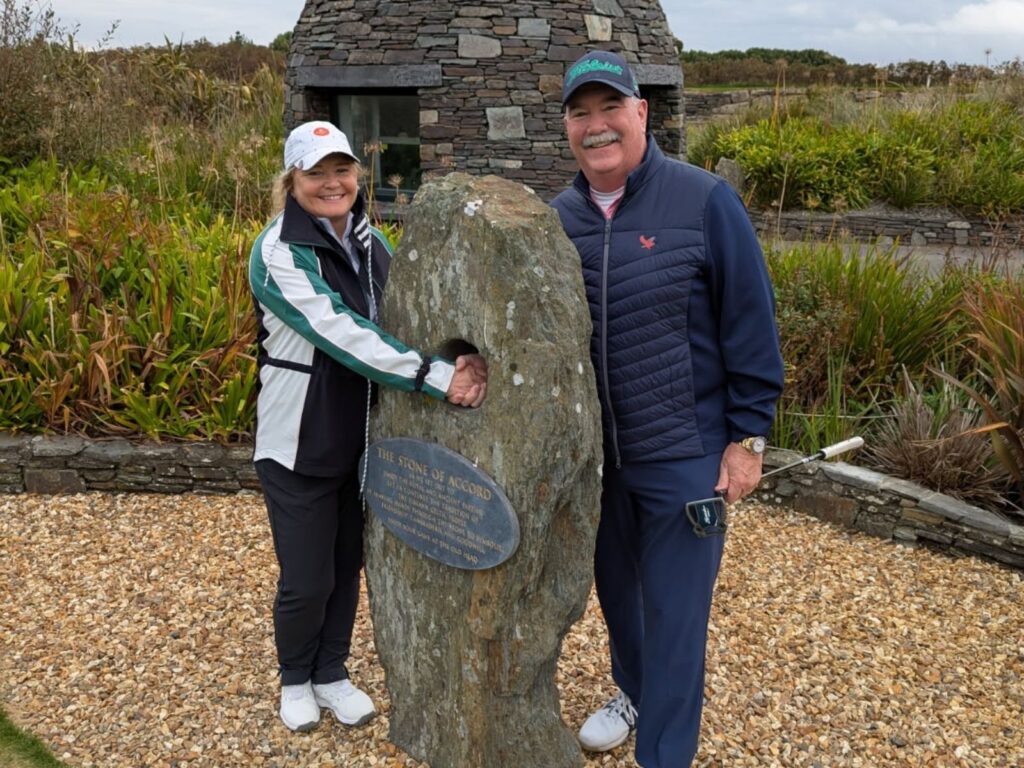 Deby & Charley Golden from Kirkbrae Country Club shake through the Stone of Accord at Old Head Golf Links.