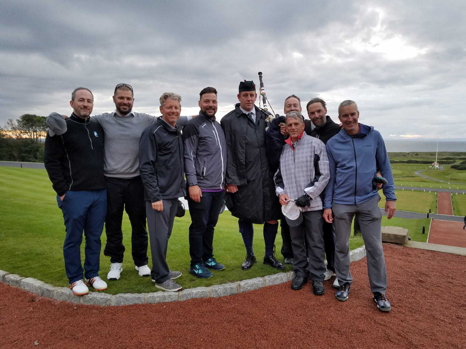 Golfers with Turnberry Scotland bagpiper