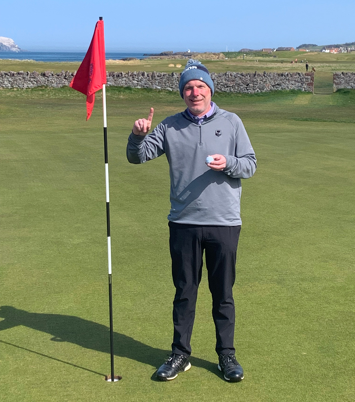 Golfer Celebrates Hole in One at North Berwick